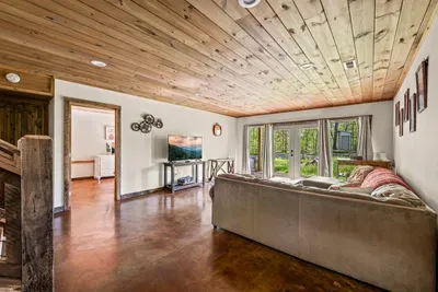 Open concept living room with electric fireplace and TV with Firestick--bring your own passwords!