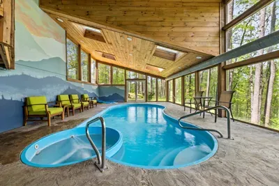 Take a dip year-round in your own private heated indoor pool, surrounded by stunning forest views through floor-to-ceiling windows.