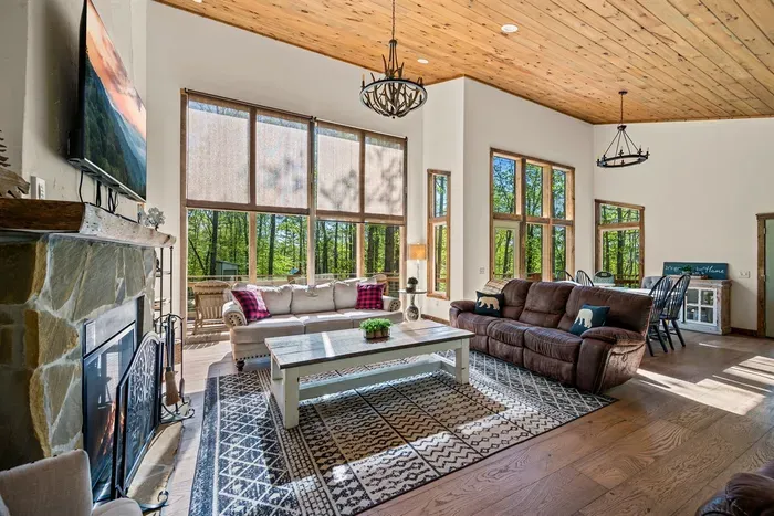 Open concept living room includes electric fire place and TV with Firestick--bring your own passwords!