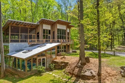 Stay in style: modern mountain home with indoor pool & huge windows.