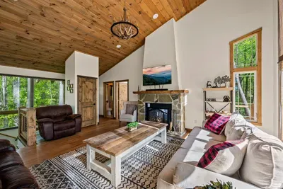 Open concept living room with electric fire place, and TV with Firestick--bring your own passwords.