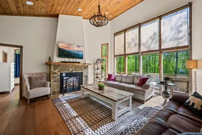 Open concept living room with electric fireplace and TV with Firestick--bring your own passwords!