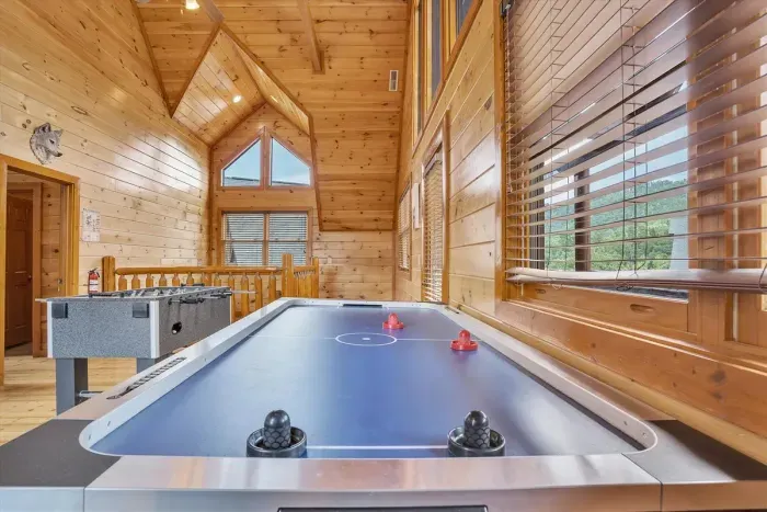 Air hockey table — who’s up for a challenge? 🏒