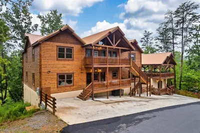 Arrive, unload, and settle in — ample parking, private fenced grounds, and a cabin that delivers from the first moment you pull up.