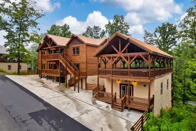 Handcrafted log cabin with soaring timber entry, wraparound decks, and room for the whole crew — first impressions that set the tone for your stay.