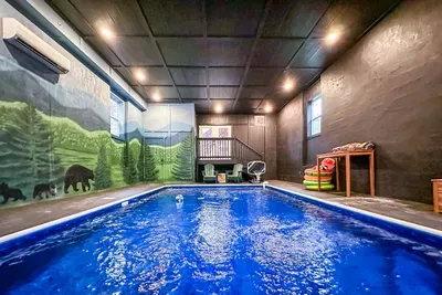 Rain or shine, the fun doesn't stop — your private indoor pool room is a full-on play zone, wrapped in a mountain mural that keeps the Smokies close.
