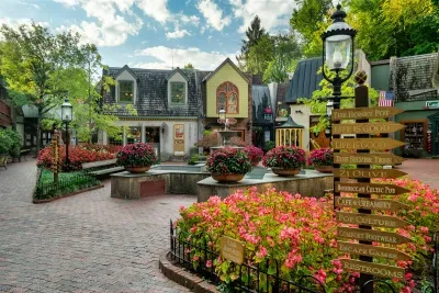 Gatlinburg's charming Village district — brick paths, blooming azaleas, boutique shops, and dozens of attractions within walking distance. Your cabin is minutes from all of this.