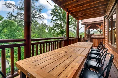 Long-table dinners under a timber pavilion roof with mountain breezes rolling through — seats the whole crew, open skies overhead, memories made right here.