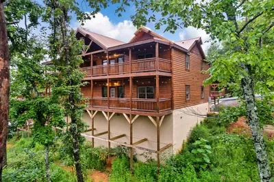 Tucked into the mountain tree line with sweeping decks at every level — your crew's cabin comes with the kind of curb appeal that signals a seriously good stay.