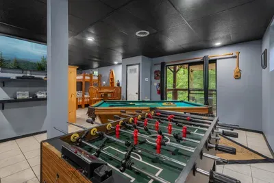 Foosball beside the pool table on the game level. Two tables, one room, and a rivalry that runs the entire length of your stay. Winner stays on.