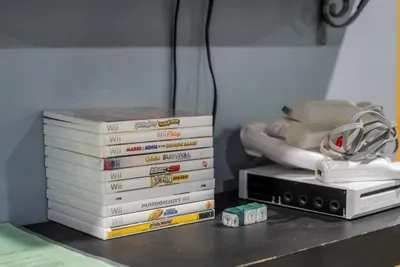Game console with a stack of titles ready to go. When the mountain weather turns, the cabin has a backup plan for every age in the group.