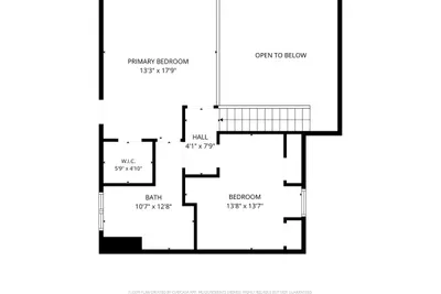 Upper level: private bedroom and full bath tucked under the vaulted roof. The quiet floor of the cabin, and the best sleep of the whole trip.