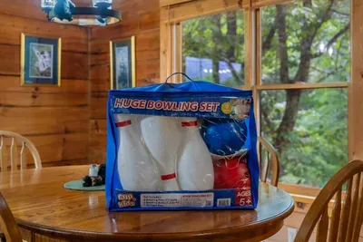 Indoor bowling set on the dining table alongside the board games. Small touches that keep kids busy on the one rainy afternoon of the trip.