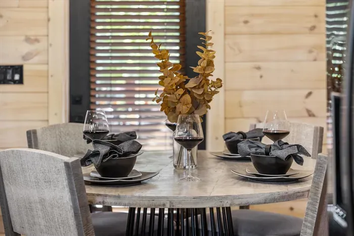 This dining area is perfectly situated next to the kitchen for easy meal service.