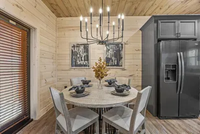 This dining area is perfectly situated next to the kitchen for easy meal service.