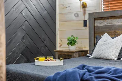 Enjoy a peaceful night's sleep in this inviting bedroom with a cozy king bed.