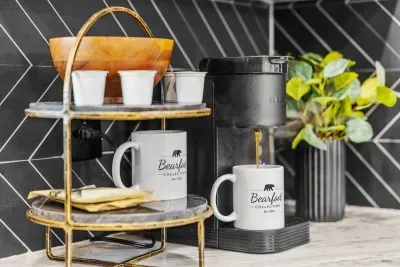 Wake up to fresh coffee in the comfort of your cabin kitchen.