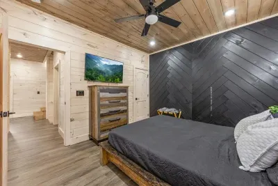This spacious bedroom features a comfortable king-size bed and a Smart TV for unwinding after a long day.