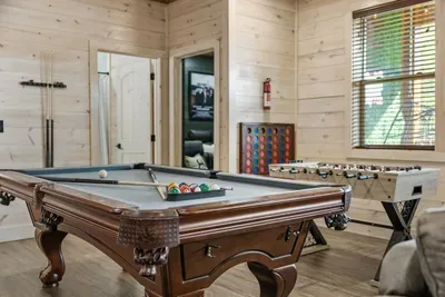 Show off your skills and sink the 8-ball on our pool table.