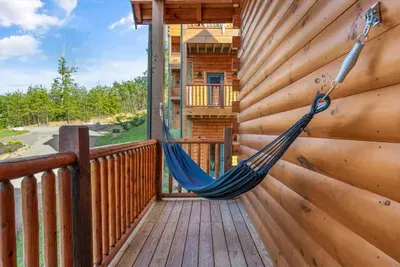 Swing into relaxation with your own private hammock on the cabin deck 🌲🛋️
