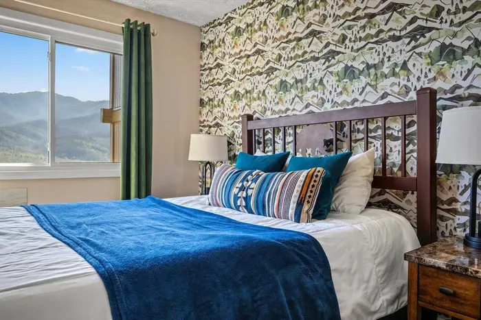Master bedroom includes a queen bed, and cable TV.