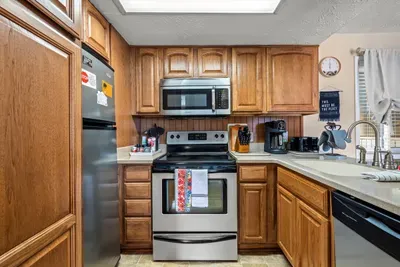 Kitchen with a coffee maker and toaster.