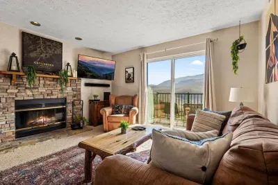 Comfortable living room includes a full sleeper sofa, cable TV, and a gorgeous view!