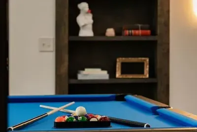 Focused moments at the table, close-up of billiards in action.