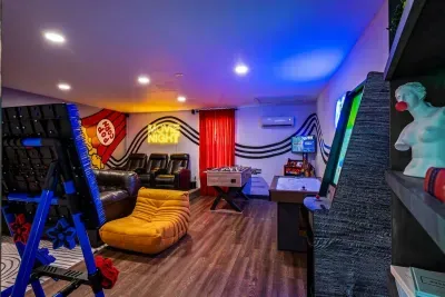 Arcade machine, air hockey, foosball, theater recliners, and a giant Connect Four — the game room that turns one night into three. No one wants to leave.