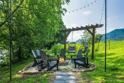 Where the river flows and the fire glows, a peaceful escape surrounded by nature.