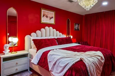 Another view of the striking red room, bold tones, cozy feel, and unique character.