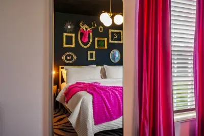 A dreamy bedroom wrapped in pink curtains, perfect for peaceful and relaxing moments.