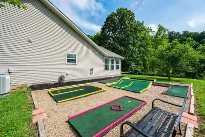 Your own private mini golf course tucked right in the backyard — four holes, open skies, and zero waiting. Tee off before dinner or make it a full tournament night.