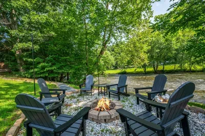 Crackling fire pit, s'mores at arm's reach, and a rushing river just steps away — your crew has a permanent spot for every night of