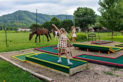 Sink a hole-in-one while horses graze just beyond the fence — your private mini golf course with sweeping mountain views is where family vacation memories are made.
