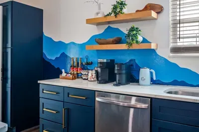 A fresh kitchen with beautiful cabinets, calm and inviting.