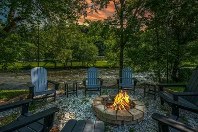 Where the river flows and the fire glows, peaceful nights under the open sky.