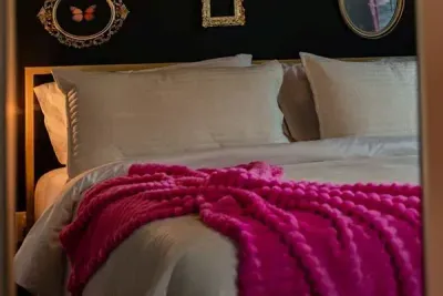 Soft details and cozy vibes, a close-up of a warm room wrapped in a pink blanket.