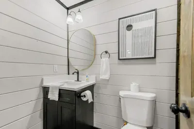 Convenient powder room near the main shared spaces.
