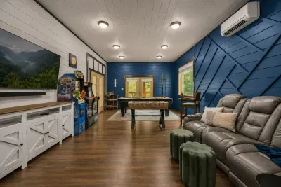 A full game room with pool, foosball, arcade games, and plenty of space for friendly competition.