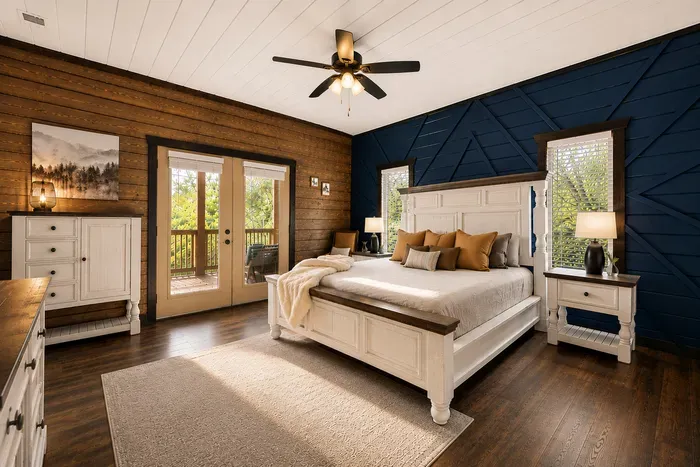 Spacious primary bedroom with a king bed, warm wood finishes, and a peaceful cabin feel.