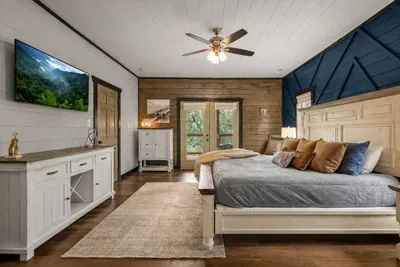 Primary suite with a king bed, TV, and direct outdoor access for a little extra privacy.