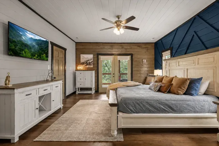 Primary suite with a king bed, TV, and direct outdoor access for a little extra privacy.