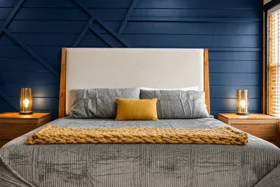 The king bed gives adults a comfortable retreat within the family bedroom, with additional bunk sleeping nearby.