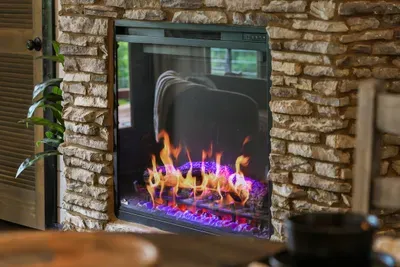 The electric fireplace adds a warm glow for slow mornings, movie nights, and evenings spent together.