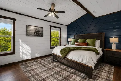 Warm wood finishes, wooded views, and a comfortable bed create an easy place to rest at the end of the day.