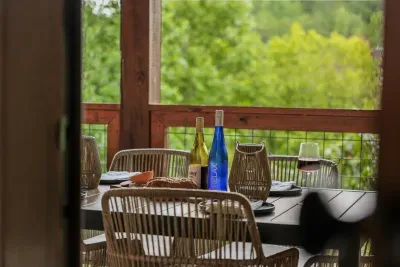 Covered balcony dining with the trees as your backdrop—just as nice for morning pancakes as dinner at dusk.