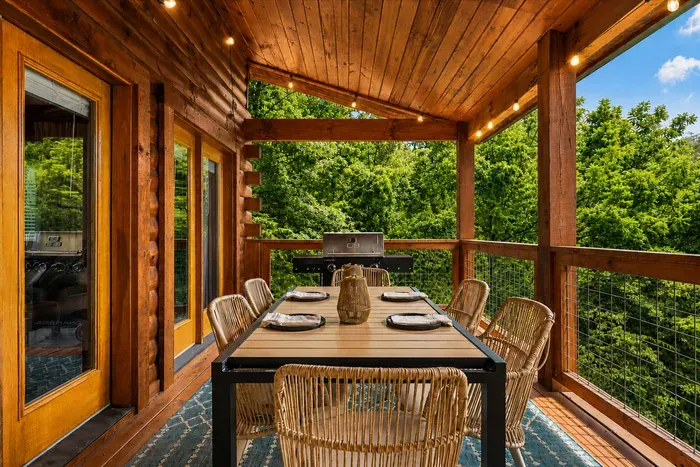 Covered balcony dining makes breakfast, dinner, and long conversations even better in the mountain air.