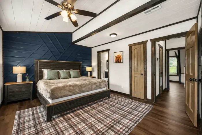 Comfortable king bedroom with warm cabin finishes and a calm place to recharge after a full day out.