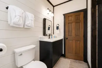 The Jack-and-Jill bathroom connects the third and fourth bedrooms, adding privacy and convenience for larger groups.